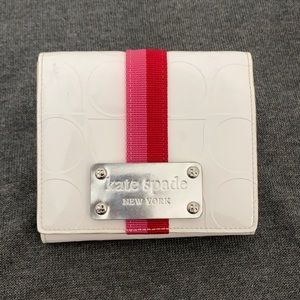 White kate spade wallet with red/pink stripe